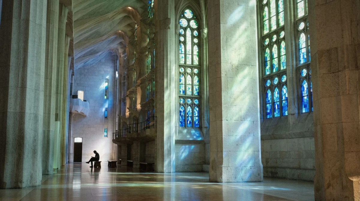 Blue and green morning light from the eastern stained glass windows on a la sagrada familia tour inside Gaudí's basilica in Barcelona